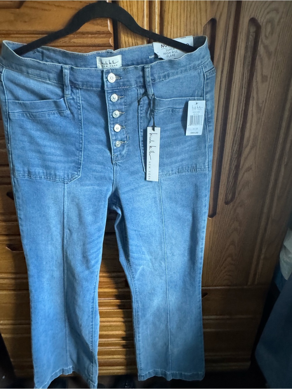 Nicole Miller is the Nomad Light Blue High-Rise Flare Jeans size 12